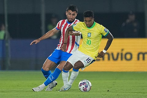 2026 FIFA World Cup Qualifying, Brazil vs Paraguay: Brazil's Rodrygo, right, is challenged by Paraguay's Junior Alonso